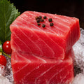 Chilled tuna block with fine white marbling on ice