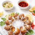 Babylon snails on crushed ice with dipping sauces